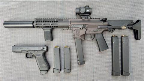 Pathfinder Defense 9mm AR with a suppressor and red dot